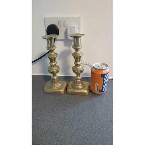 554 - PAIR OF BRASS CANDLESTICKS