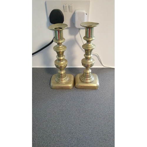 554 - PAIR OF BRASS CANDLESTICKS