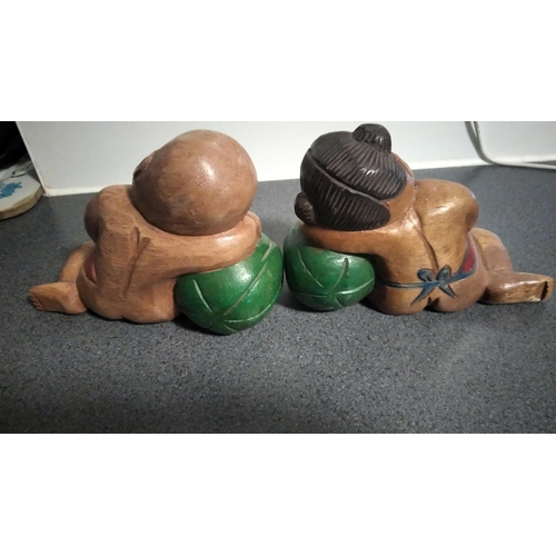 504 - PAIR OF WOODEN ORIENTAL BOOK END FIGURES