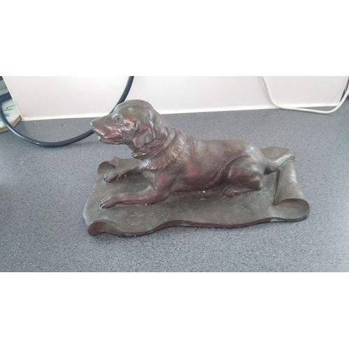 518 - RESIN DOG ON CARPET BRONZE COLOURED