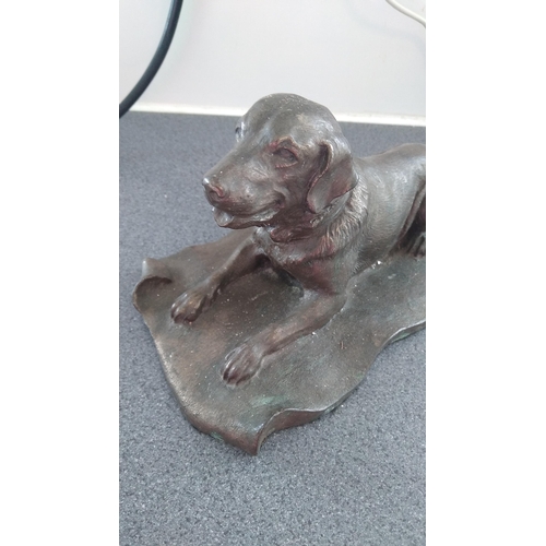 518 - RESIN DOG ON CARPET BRONZE COLOURED