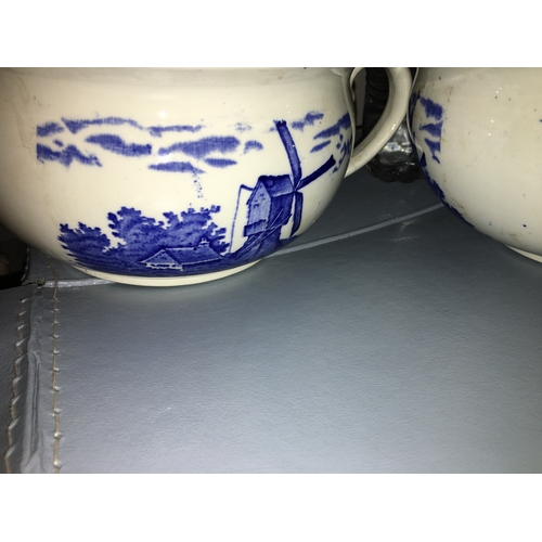 725 - PAIR OF BLUE AND WHITE CHAMBER POTS WITH WINDMILL SCENES