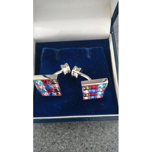 641 - BOXED PAIR OF MULTI COLOURED STONE CUFFLINKS