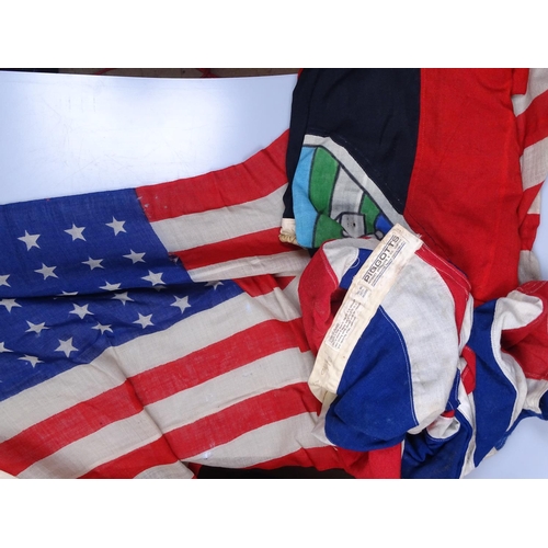 104 - A quantity of cotton flags, including America and a Union Jack