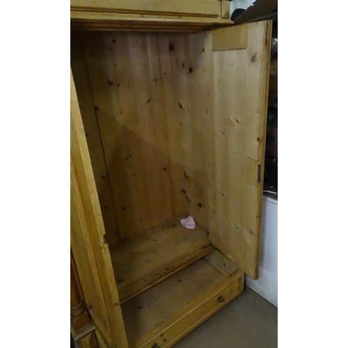 1100 - An Antique Continental pine cupboard, with 2 panelled doors and a drawer to the base, W108cm