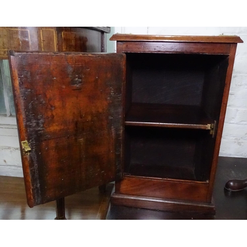 1103 - A 19th century mahogany table-top cabinet, with single panelled door and brass mounts, W32cm, H50cm