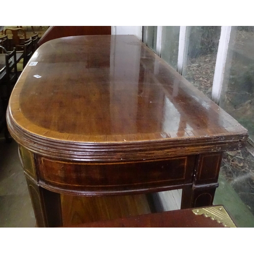 1104 - A 19th century cross-banded mahogany fold over card table, with inlaid decoration, raised on tapered... 