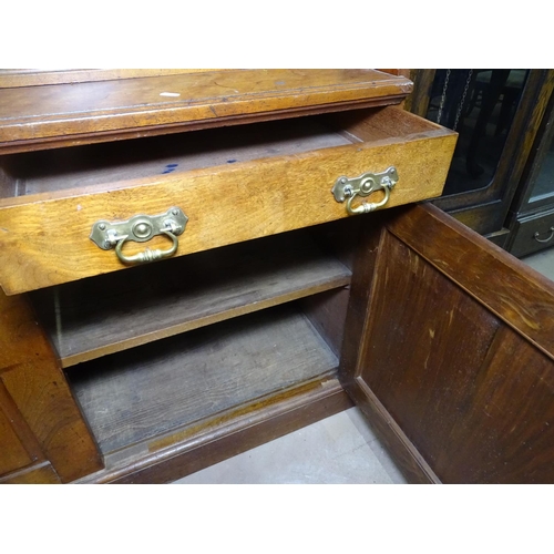 1115 - A tall Edwardian mahogany cabinet, with open shelves, glazed cupboards, drawers and fitted fall pane... 