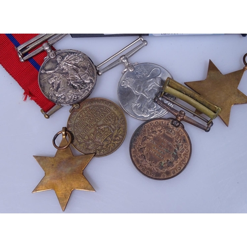 112 - An Edward VII Coronation medal, a Victoria Metropolitan Police medal 1897, Second World War medals e... 