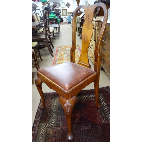 1121 - An early 20th century walnut round-cornered wind-out dining table, raised on cabriole legs, together... 