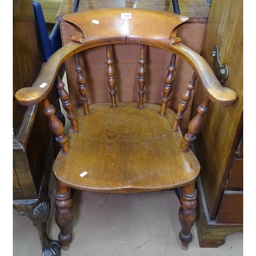 1137 - A Victorian oak Captain's bow-arm chair, on turned legs