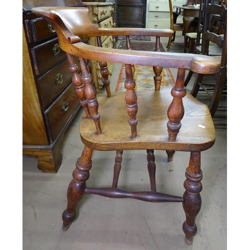 1137 - A Victorian oak Captain's bow-arm chair, on turned legs