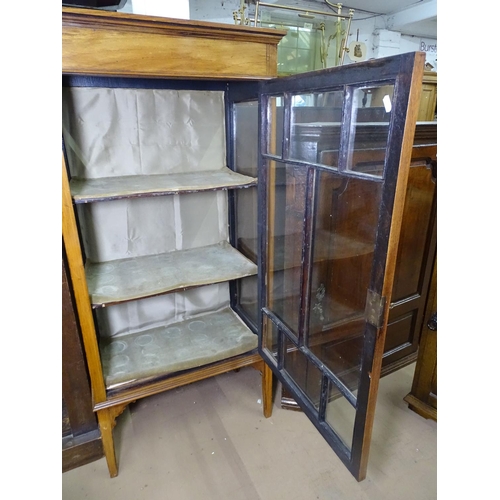 1159 - An Edwardian mahogany and banded display cabinet, with single glazed door, raised on square tapered ... 