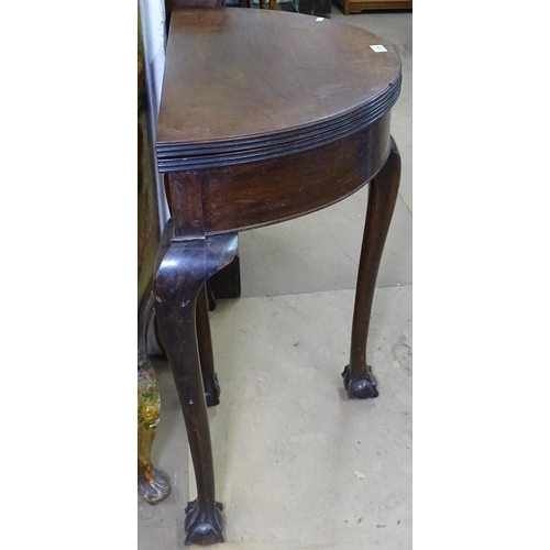 1170 - A 19th century mahogany bow-front fold over card table, raised on cabriole legs with claw and ball f... 