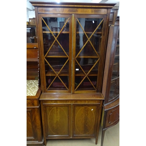 1190 - A late Victorian mahogany 2-section library bookcase, with 2 lattice glazed doors, and adjustable sh... 