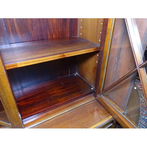 1190 - A late Victorian mahogany 2-section library bookcase, with 2 lattice glazed doors, and adjustable sh... 