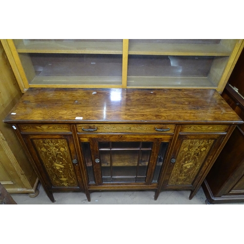 1195 - A Victorian rosewood sideboard, with a fitted drawer, beveled glazed cupboard door under flanked by ... 