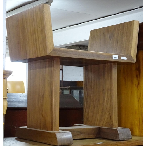 1198 - A contemporary solid walnut winged dressing stool, of massive construction, W64cm, H66cm