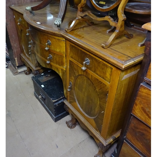 1219 - A late 19th century mahogany bow-front sideboard, with fitted drawers and cupboards, raised on 6 cab... 