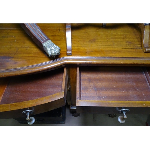 1219 - A late 19th century mahogany bow-front sideboard, with fitted drawers and cupboards, raised on 6 cab... 