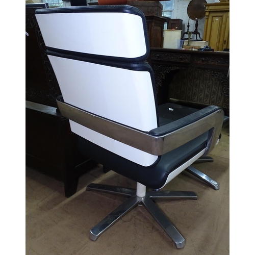 1225 - A Konig & Neurath, (Germany), black leather Charta lounge chair and ottoman, with white gloss back o... 