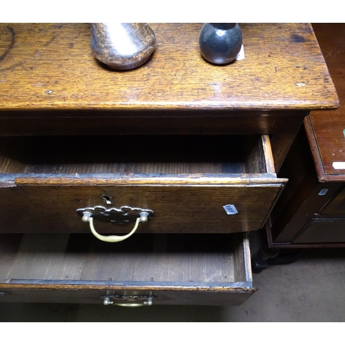 1228 - A George III oak chest of 2 short and 3 long drawers, on bracket feet, W82cm