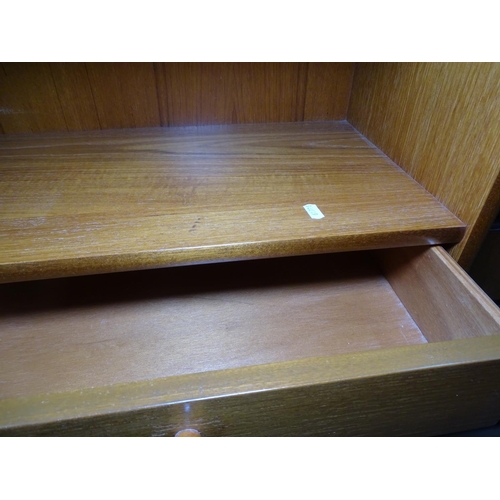 1239 - A teak lounge cabinet, with drawers, open shelves and glazed sliding cupboards, by Nathan, label to ... 