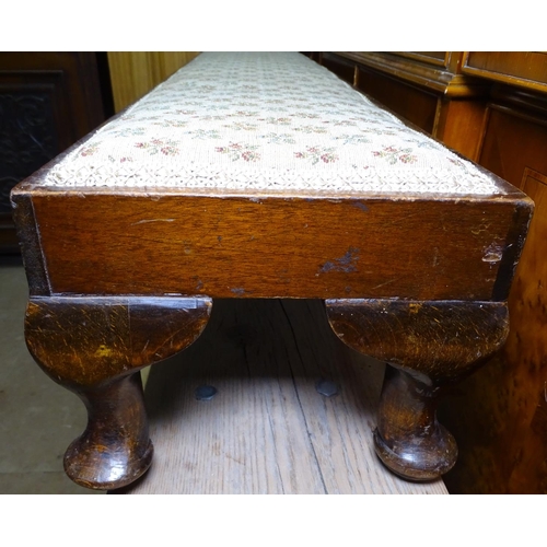 1269 - An Edwardian mahogany and upholstered fender stool, L131cm