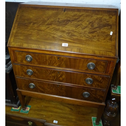 1282 - A cross-banded walnut 3-drawer bureau, W78cm