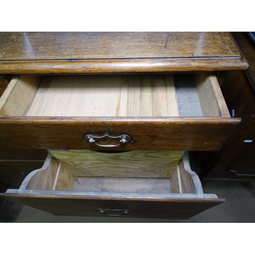 1288 - A 1930s oak office bank of 8 drawers, W95cm, H112cm, D62cm