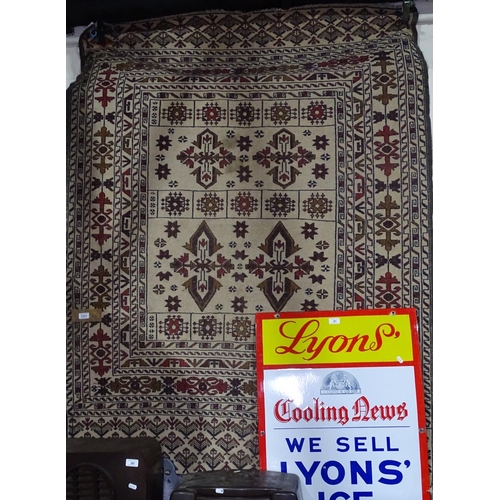 1311 - A cream ground Kilim rug, 183cm x 137cm