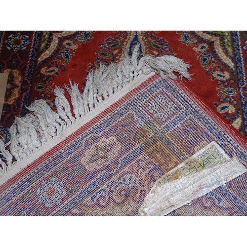 1314 - A red ground wool runner, 270cm x 69cm