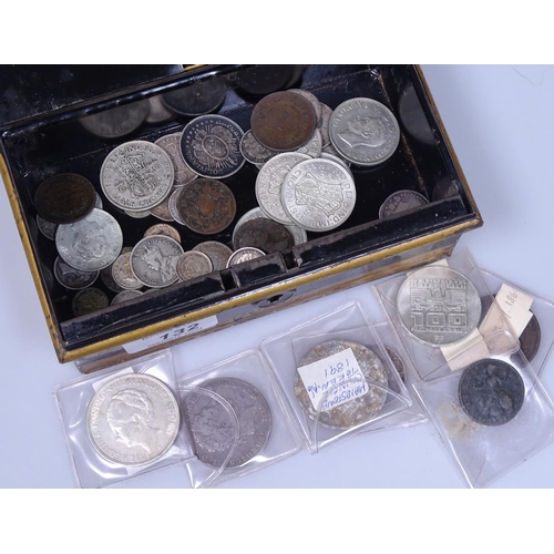 132 - A cash tin containing various coins, including silver