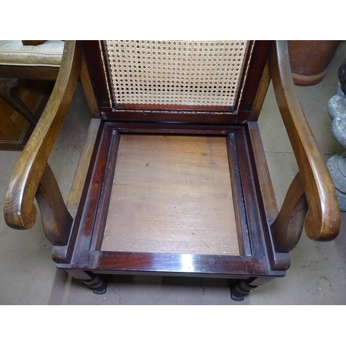 1340 - A mahogany and cane panelled invalid's chair