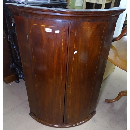 1341 - A George III mahogany hanging corner cupboard, with 2 banded doors, and fitted shelves, W80cm, H112c... 