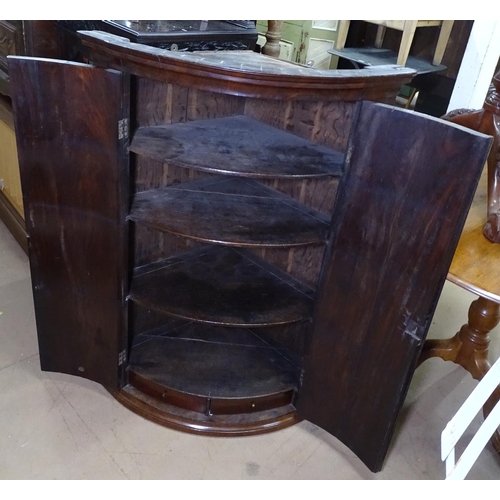 1341 - A George III mahogany hanging corner cupboard, with 2 banded doors, and fitted shelves, W80cm, H112c... 