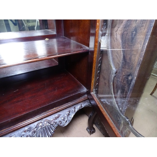 1343 - A Victorian mahogany side cabinet, with a raised carved and pierced mirror back, a glazed door under... 