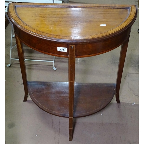 1344 - A mahogany demilune and ebony-banded side table, with a rising panelled lid and shelf under, W60cm