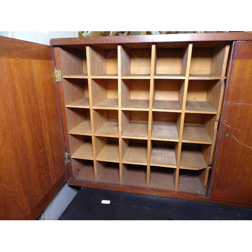 1347 - A 1920s teak hanging 2-door cabinet, the 2 doors opening to reveal 50 small pigeon holes, L88cm, H44... 