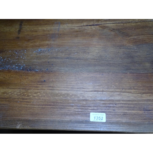 1352 - A large rectangular pine kitchen table, on square tapered legs, L200cm, D85cm, H77cm