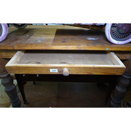 1361 - A rectangular pine kitchen table, single drawer on baluster legs, L125cm