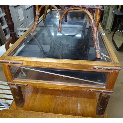 1369 - A rectangular teak-framed and glass panelled display table, L122cm, H43cm