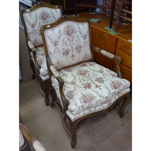 1381 - A pair of French stained beech fauteuils, with acanthus leaf carved decoration, raised on cabriole l... 