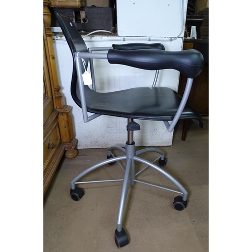 1387 - A post-modern black office chair, with unusual arms