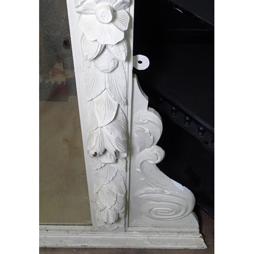 1393 - A white painted acanthus leaf and lion mask carved over mantel mirror, W160cm, H156cm