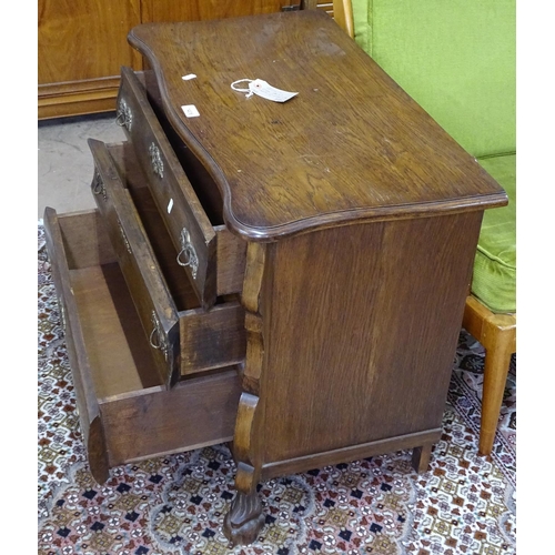 1406 - A small French oak bomb chest, with 3 long drawers on carved feet, W75cm, H64cm