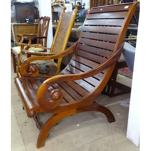 1427 - A large stained hardwood plantation chair, with scrolled arms