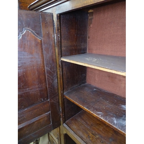 1439 - An Antique French walnut cabinet, with fitted panelled cupboard doors and scrolled cabriole feet, W1... 