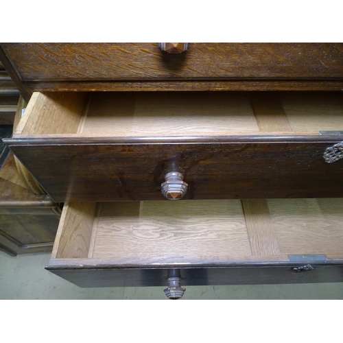 1444 - A 1920s oak chest on stand, top fitted with 2 short and 3 long drawers, stand raised on barley twist... 