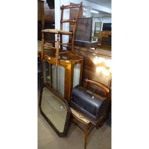 1455 - A 1930s walnut display cabinet, an oak-framed wall mirror, a sewing machine and a pair of hall chair... 